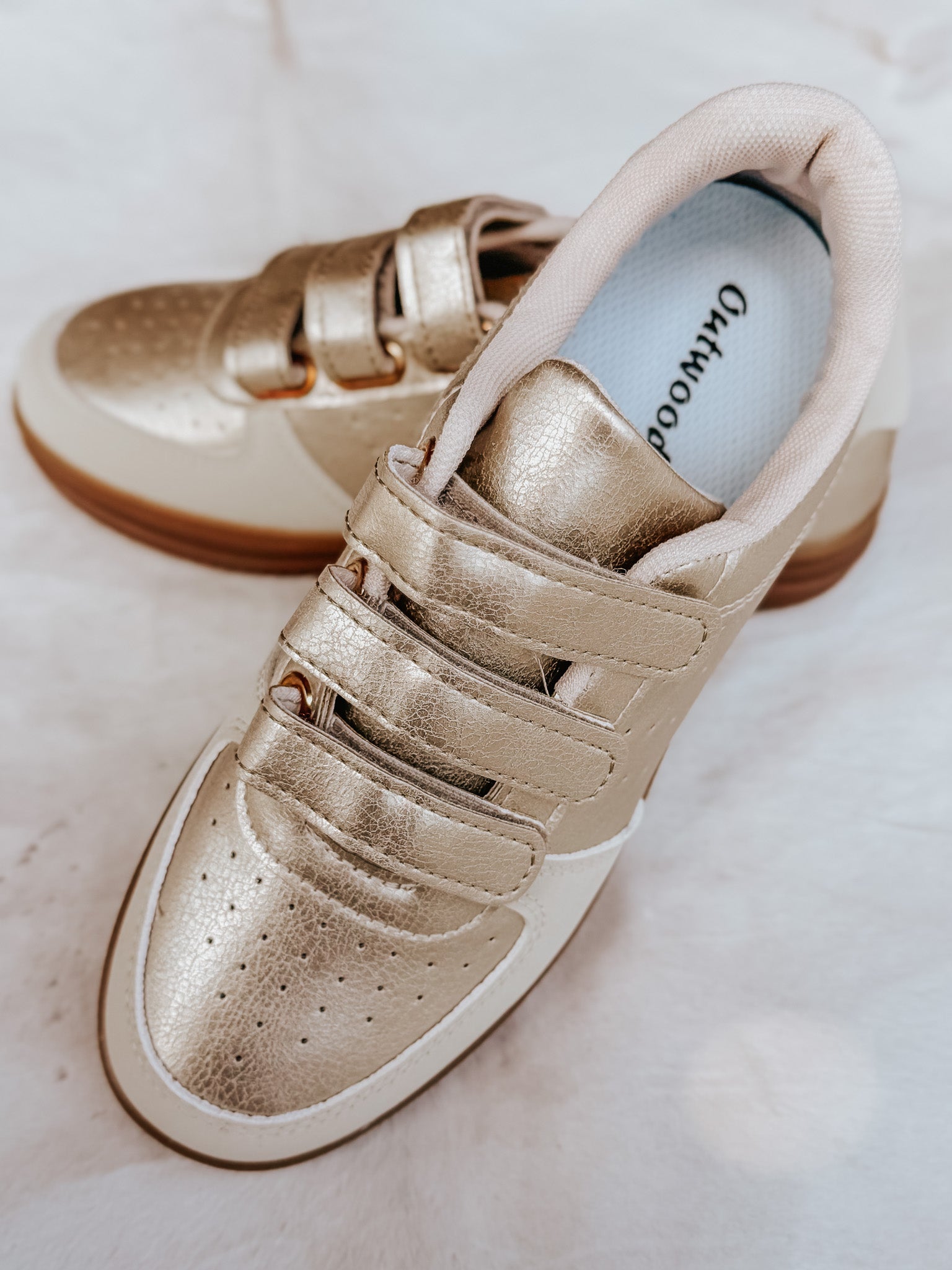 The Madelyn Sneaker in Gold