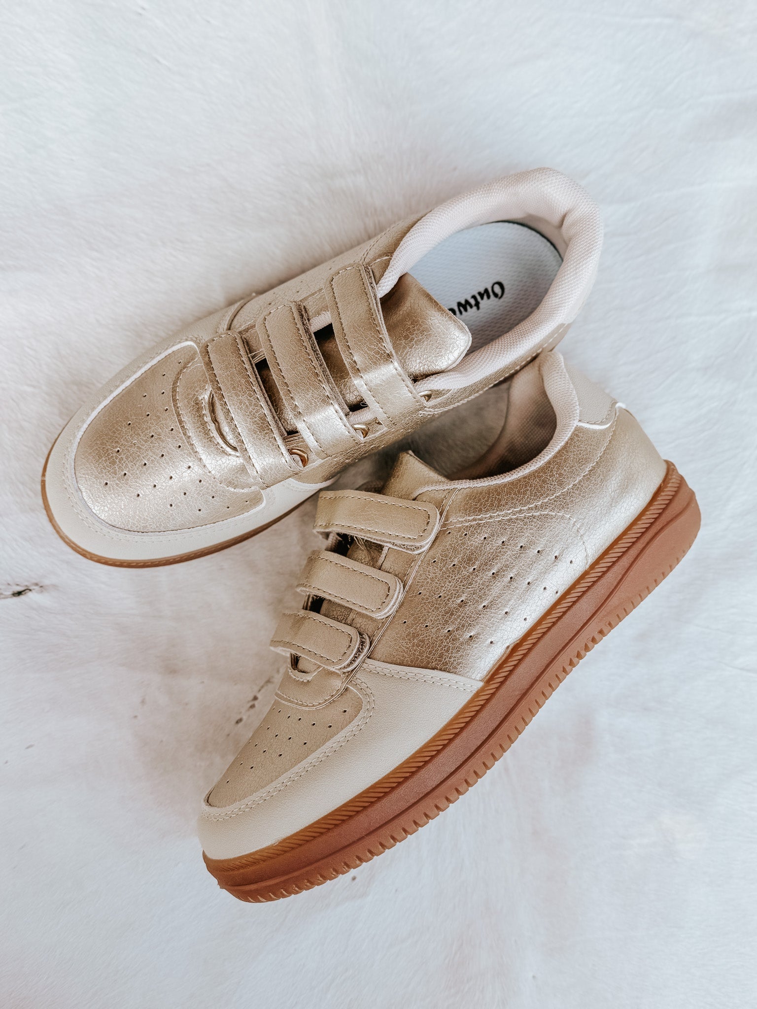 The Madelyn Sneaker in Gold